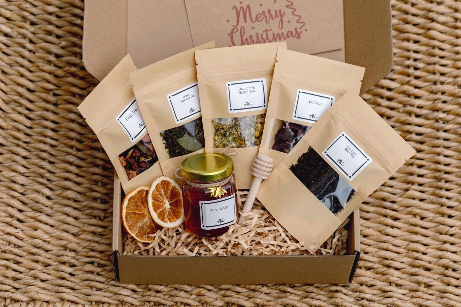 Five Tea & Honey Gift Set 1 Gift box with five loose leaf teas, natural honey, dried orange, and a wooden honey dipper